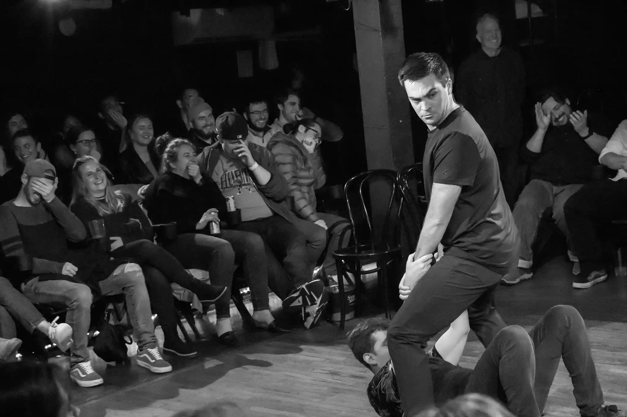 Laughing audience during Psyched Out Comedy's improv psychic performance – top comedy show in New England