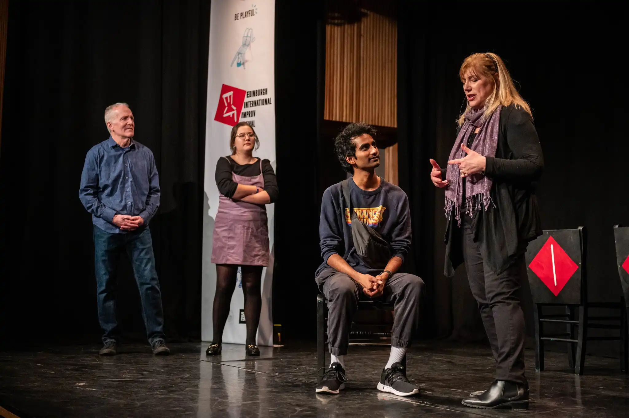 Cast members in the middle of a psychic improv sketch – Psyched Out Comedy live in Boston