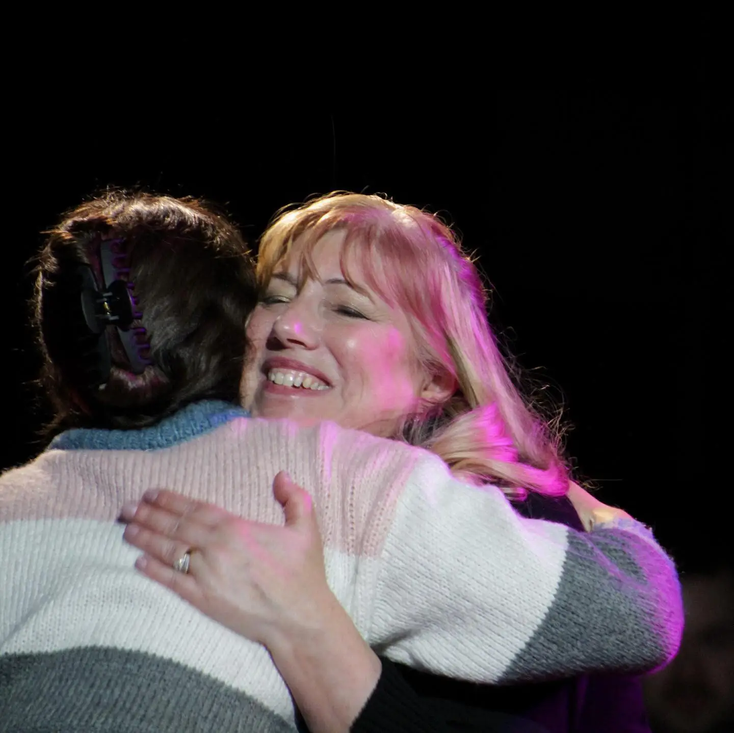 Heartfelt moment between psychic and guest during Psyched Out Comedy – live comedy show with real readings in New England
